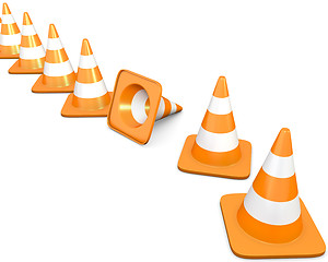 Image showing Diagonal line of traffic cones with one fallen cone