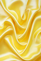 Image showing Smooth elegant golden silk as background 