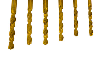 Image showing Various size golden drill bits isolated on white 