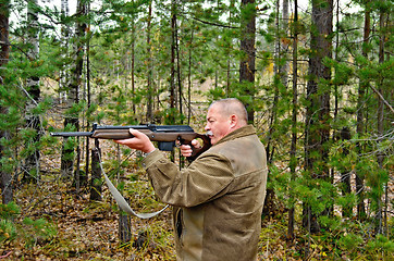 Image showing Man with a carbine