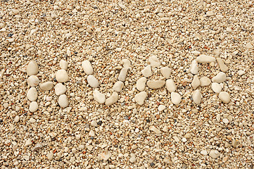 Image showing HVAR word made of pebbles, authentic picture of Hvar's beach