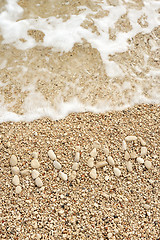 Image showing HVAR word made of pebbles, authentic picture of Hvar's beach