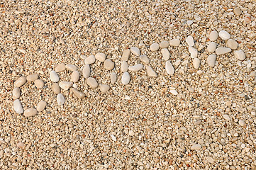 Image showing Croatia word made of pebbles, authentic picture of Hvar's beach