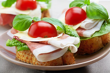 Image showing Sandwich with prosciutto, parmesan cheese and tomato