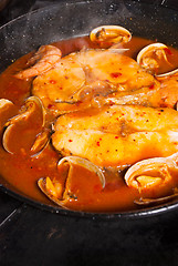 Image showing Cooking hake in sauce