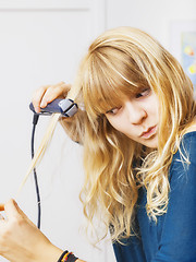 Image showing teenager smooting her hair