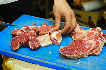 Image showing cutting meat