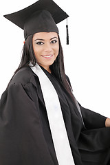 Image showing Female graduate wearing a gown and mortarboard - isolated over w