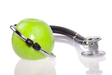 Image showing Stethoscope and apple