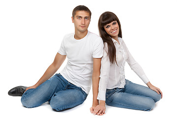Image showing Romantic young couple sitting on floor