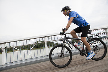 Image showing Riding mountain bike