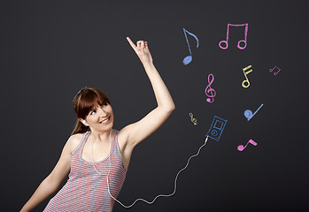 Image showing Girl dancing with musical notes