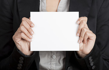 Image showing Holding a paper card