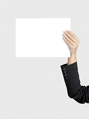 Image showing Holding a paper card