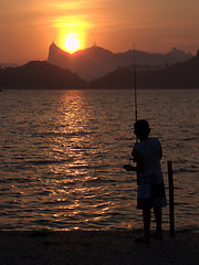 Image showing Kid fishing on the sunset in Rio de Janeiro