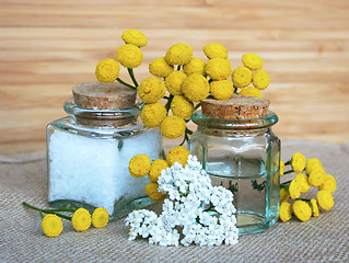 Image showing Bottles of essential oil and sea salt in spa composition