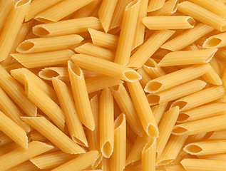 Image showing A background of fresh uncooked Penne pasta