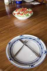 Image showing Bowl of Salad and an Empty Plate