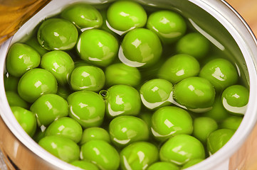 Image showing Tin can with green peas