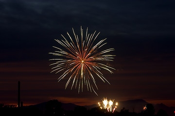 Image showing Firecrackers In The Sky During Sunset