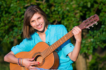 Image showing Teenage girl with guitar