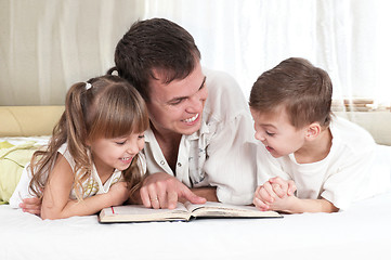 Image showing Family with book