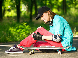 Image showing Teenage girl with skateboard