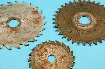 Image showing circular saw disks blades on blue 