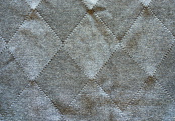 Image showing Knitted wool pattern rhomb form grey background  