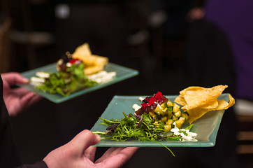 Image showing Serving appetizers