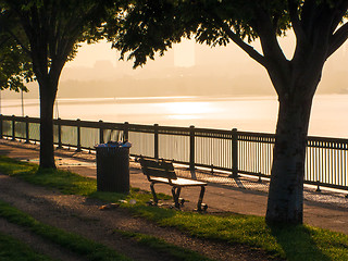 Image showing Park bench at rivers' edge