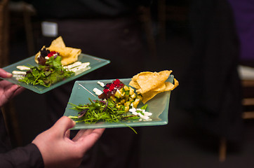 Image showing Serving appetizers