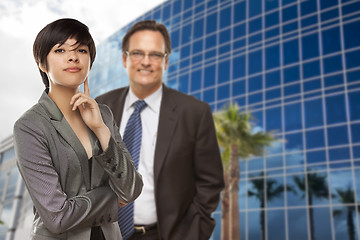 Image showing Mixed Race Woman and Businessman in Front of Building