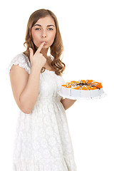 Image showing Young pretty girl with a cakes
