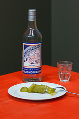 Image showing Still a bottle of vodka, snack and a glass