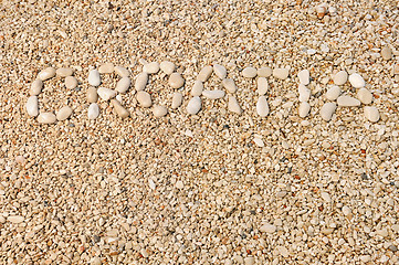 Image showing Croatia word made of pebbles, authentic picture of Hvar's beach