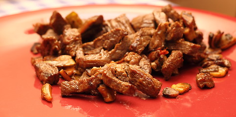 Image showing meat on red dish
