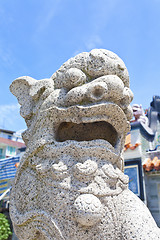 Image showing Lion statue outside a temple