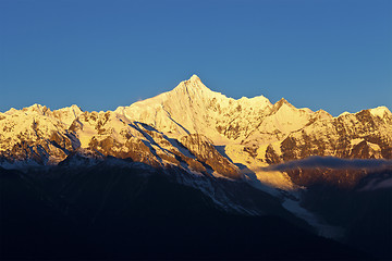Image showing Sunrise at snow mountains