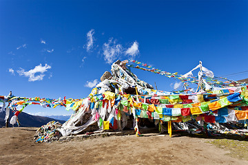 Image showing Colorful prayer flags and snow mountain 