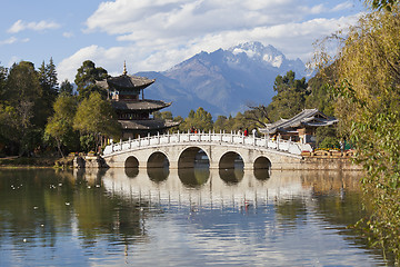 Image showing Lijiang old town and Jade Dragon Snow Mountain in China