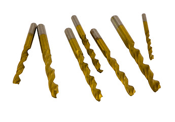 Image showing Various size golden drill bits isolated on white 