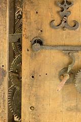 Image showing Retro wooden clock grunge mechanism gear closeup 