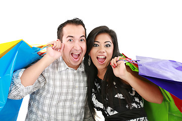 Image showing Beautiful young couple with shopping bags. Isolated on white 