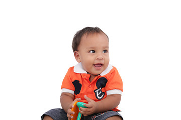 Image showing Adorable one year old child playing and having a good time, isol