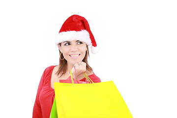 Image showing Shopping Christmas woman smiling. Isolated over white background