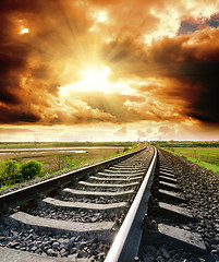 Image showing railway to cloudy sky at sunset
