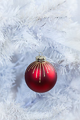 Image showing Red Christmas ball hanging on white tree