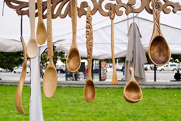 Image showing handmade carved spoons sell outdoor market 