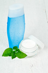 Image showing face cream and lotion with urtica leaves 